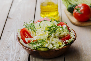 Cabbage salad with cucumbers and tomatoes