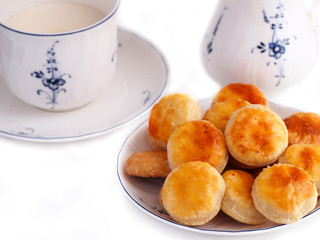 Homemade cheese cookies and cup of milk