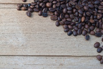 coffee beans in rustic wood background - overhead view