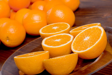 sliced ripe appetizing delicious orange on brown table