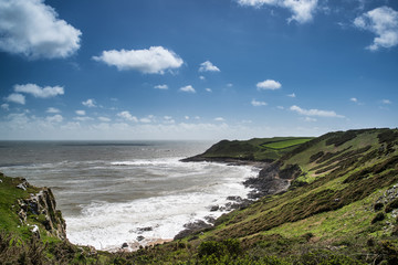 Summer landscape of Worm's Head and Rhosilli Bay in Wales