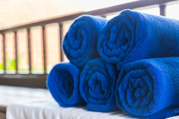 Obraz na płótnie Canvas folded blue towel for spa massage