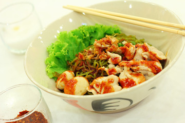 close up thai spicy pork noodle in ceramic cup