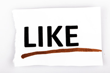The word like on torn paper