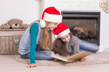 Sisters reading a Christmas story.