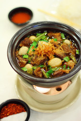 close up thai spicy pork noodle in ceramic cup