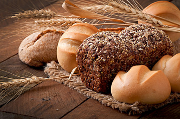 Assortment of baked bread on a wooden table