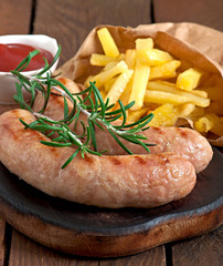 Chicken sausages grilled with a side dish of french fries