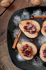 Baked pears with cranberries, honey and walnuts