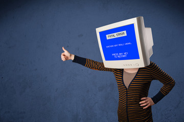 Person with a monitor head and fatal error blue screen on the di