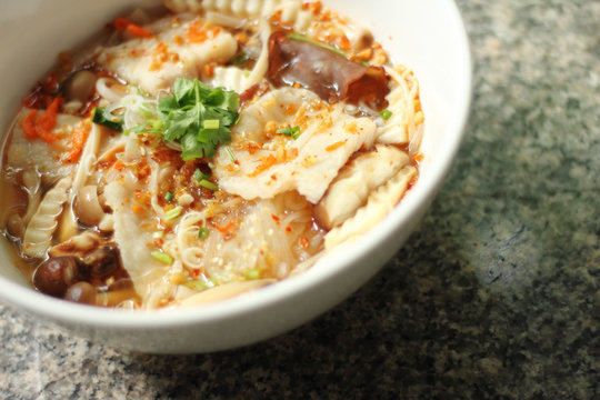 close up thai spicy fish noodle in ceramic cup