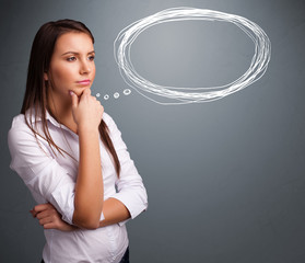 Young lady thinking about speech or thought bubble with copy spa