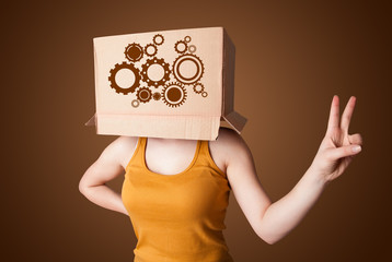 Young woman gesturing with a cardboard box on his head with spur