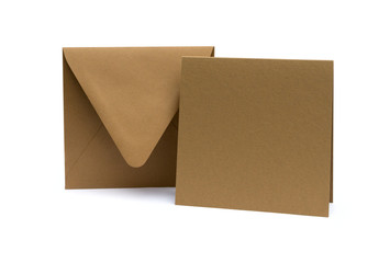 brown envelope with a blank card over white