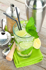 Fresh mojito cocktail and bar utensils