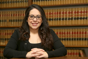 Young Female Hispanic Lawyer black dress