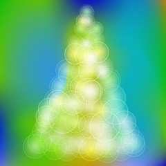 Christmas tree in a colorful bokeh in the background. Raster 1