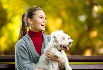 Smiling young woman with dog