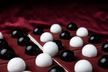 Black and white balls and bones on the wells and velvet