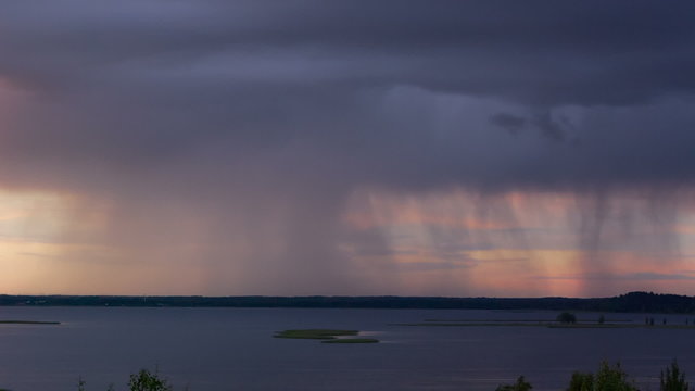 Thunderstorm with heavy rain over the lake