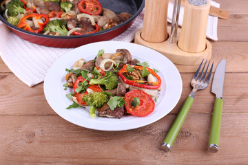 Braised wild mushrooms with vegetables and spices in pan and