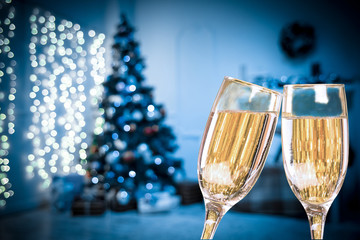 Obraz na płótnie Canvas Two Champagne Glasses On Defocused Background Living Room