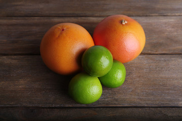 Ripe citrus on wooden background