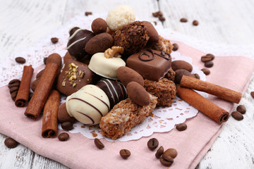 Heap of sweet chocolates with coffee beans