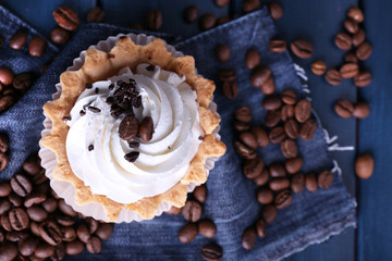 on blue wooden background with jeans material