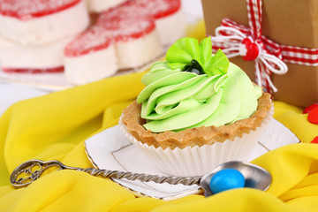 Sweet cakes on birthday table close-up