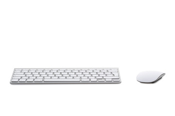 White computer mouse on the keyboard