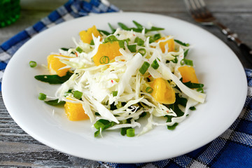 Fresh cabbage salad and orange