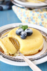 Lemon delicious pudding cake  served with berries