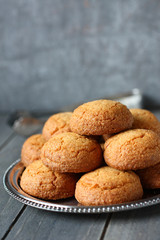 Heap of almond cookies on metal plate