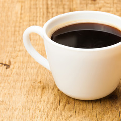 Black coffee cup on wooden table - studio shoot