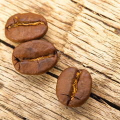 Close up shot of tree neat roasted coffee beans