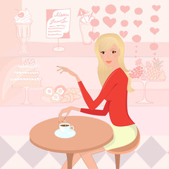 Pretty woman with a cup of coffee in the pastry-shop