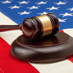 Judge gavel and soundboard over USA flag