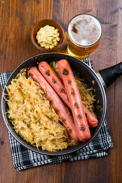 Bavarian fried sausages on sauerkraut