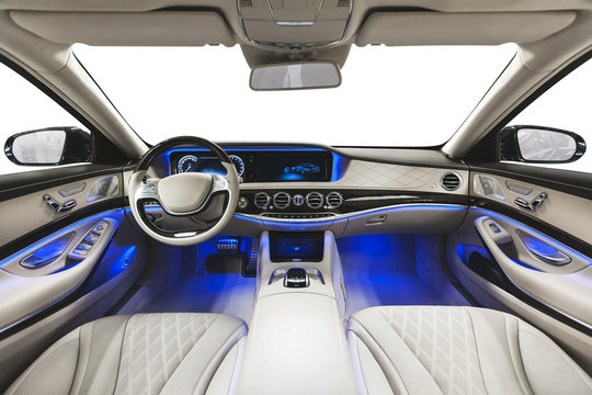 Interior of car. White seats blue ambient light