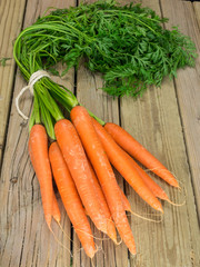 bunch of carrrots with green leaves