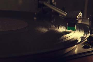 turntable under light beam, vintage colors stylised