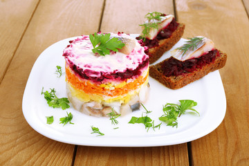Russian herring salad  and sandwiches