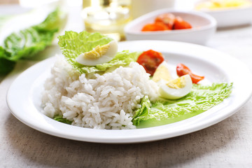 Boiled rice served on table, close-up