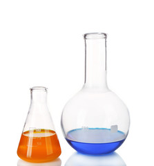 Two flasks with blue and orange fluid on table isolated on