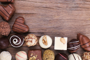 Group of sweets on wooden textured background