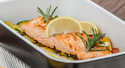 Salmon baked with thyme and Mediterranean vegetables