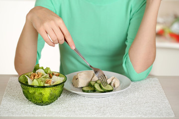 Girl and dietary food at table close-up