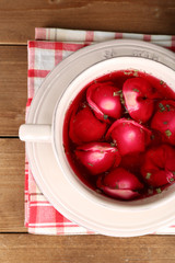 Traditional polish clear red borscht with dumplings