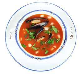 Tasty mussel soup isolated on white
